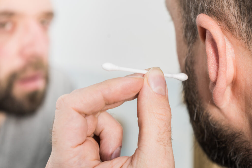 Man from essex using cotton bud in ear